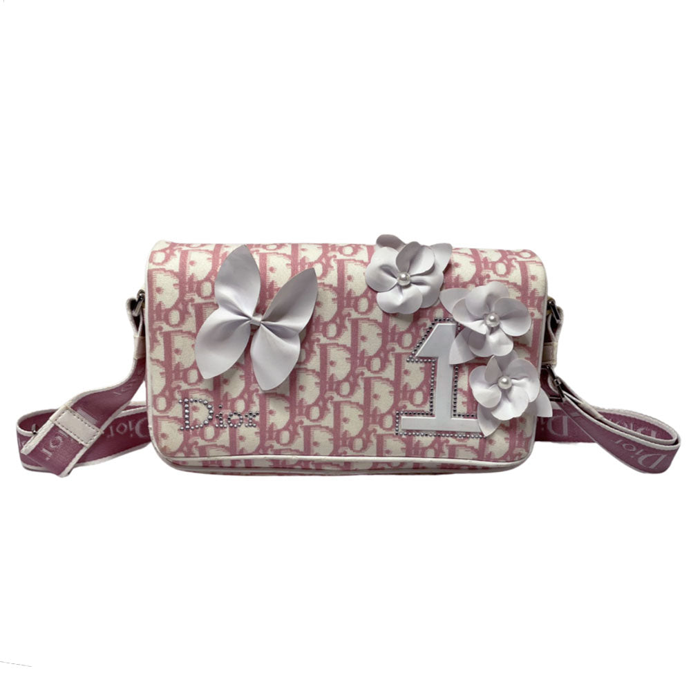 Christian Dior pink monogram canvas girly flap bag by John Galliano for Dior 2004 with pearl center white flowers, white patent piping, Swarovski crystal No 1 and Dior crystal logo. Pink with white edged satin canvas adjustable shoulder strap. Pink textile interior, one interior pocket. Made in Italy