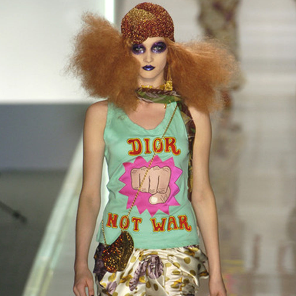 Christian Dior Runway Dior Not War white tank by John Galliano for Christian Dior S/S 2005 with front Dior Not War appliqué in red, with yellow embroidered edge and animated fist bursting out of magenta explosion and 3 red stars in back. Banded neck and arm holes. Made in France Size: FR 36 / USA 4