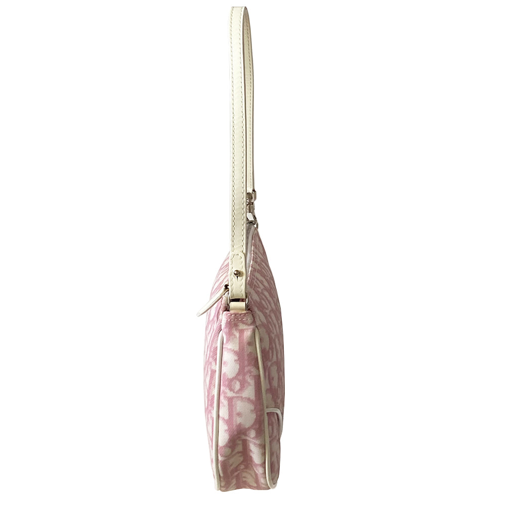 Christian Dior pink diorissimo canvas mini saddle bag by John Galliano for Dior, 2004.th White leather piping and strap, silver-tone hardware. Top zipper closure with Dior embossed leather zipper pull, pink textile interior. Made in Spain