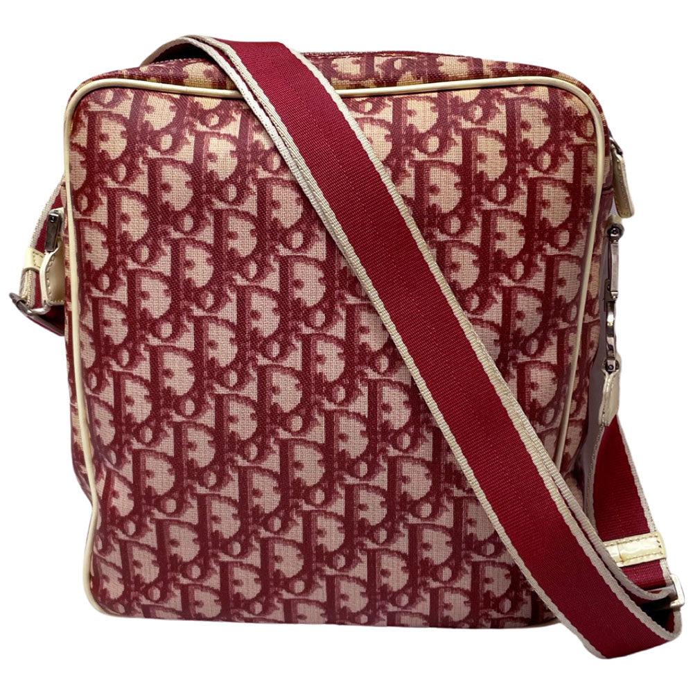 Christian Dior red monogram canvas slim reporter bag by John Galliano for Dior 2004 with white patent No 1 and 2 stripes in front, piping and accents, red with white edged satin canvas webbing adjustable shoulder strap. Top zip closure with red textile interior and one interior zip pocket. Made in Italy