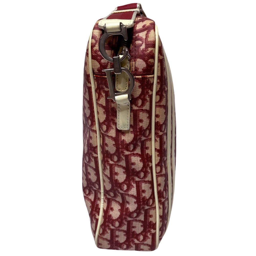 Christian Dior red monogram canvas slim reporter bag by John Galliano for Dior 2004 with white patent No 1 and 2 stripes in front, piping and accents, red with white edged satin canvas webbing adjustable shoulder strap. Top zip closure with red textile interior and one interior zip pocket. Made in Italy
