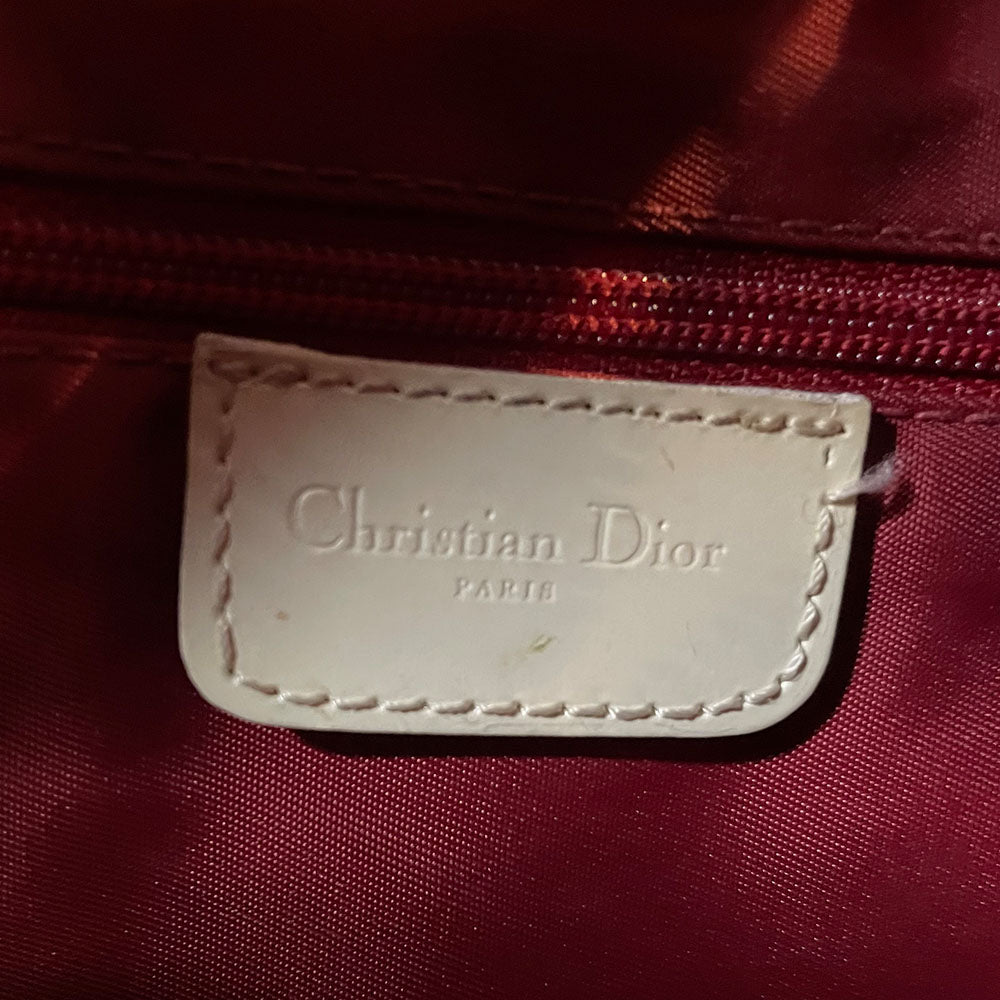 Christian Dior red monogram canvas slim reporter bag by John Galliano for Dior 2004 with white patent No 1 and 2 stripes in front, piping and accents, red with white edged satin canvas webbing adjustable shoulder strap. Top zip closure with red textile interior and one interior zip pocket. Made in Italy