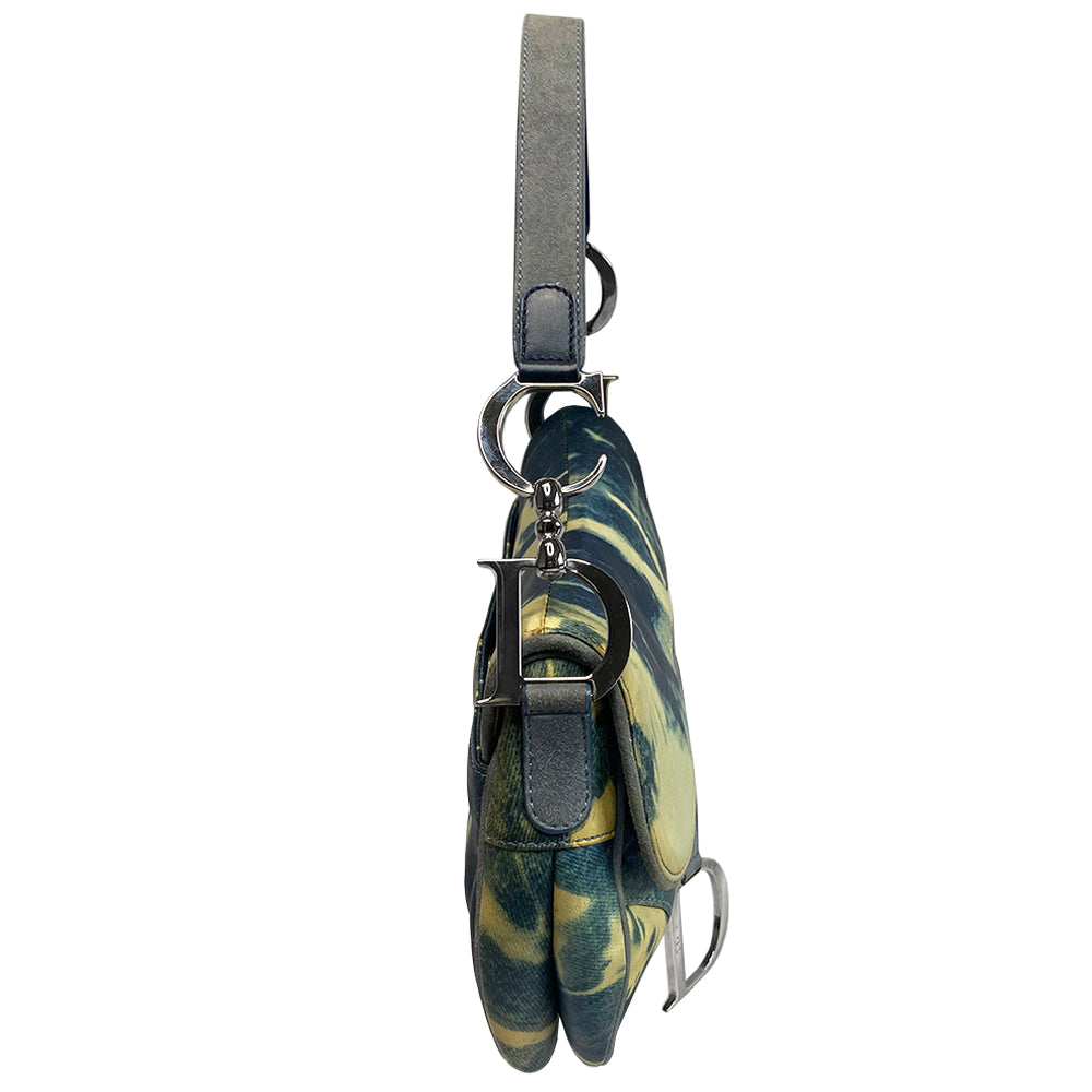 Christian Dior blue and yellow tie dye leather saddle bag by John Galliano for Dior, 2000 with silver tone hardware, single rear slip pocket, velcro front closure. Interior blue and white tie dye lining with single zip pocket. Made in Italy