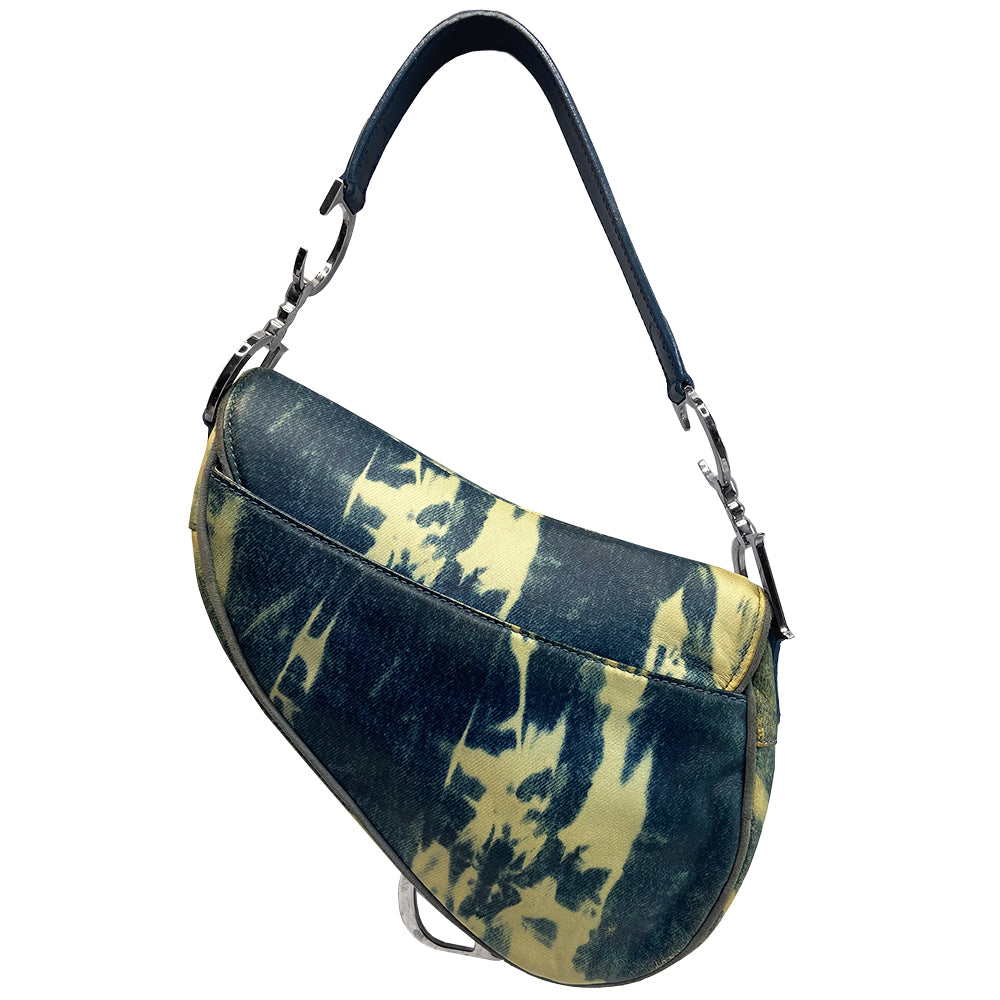 Christian Dior blue and yellow tie dye leather saddle bag by John Galliano for Dior, 2000 with silver tone hardware, single rear slip pocket, velcro front closure. Interior blue and white tie dye lining with single zip pocket. Made in Italy