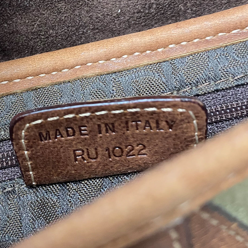 Christian Dior khaki canvas saddle bag by John Galliano for Dior 2002 with burnished gold-tone hardware, brown leather accent. Single flat top leather handle with CD logo adornments at each side. Velcro at flap closure with feature gold-tone D logo. Rear single slip pocket. Black/grey logo textile lined with zip pocket. Made in Italy