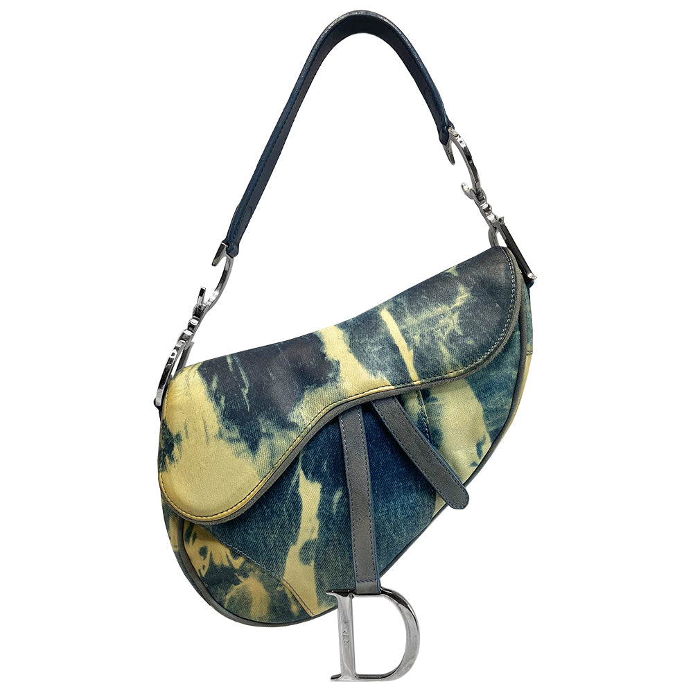 Christian Dior blue and yellow tie dye leather saddle bag by John Galliano for Dior, 2000 with silver tone hardware, single rear slip pocket, velcro front closure. Interior blue and white tie dye lining with single zip pocket. Made in Italy