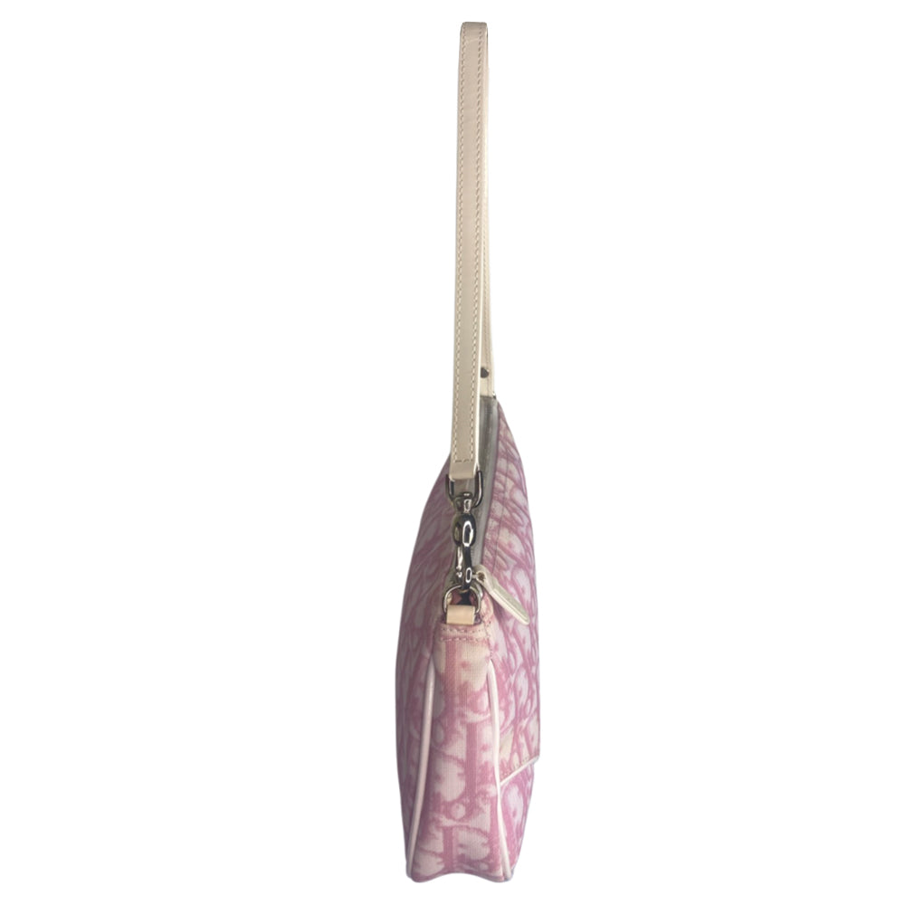 Christian Dior pink canvas monogram mini saddle pochette by John Galliano for Dior 2004 with white patent leather piping and strap, silver-tone hardware. Leather strap unclips at one end and can be looped to carry wristlet style. Top zipper closure with pink textile interior. Duster and card included. Made in Spain