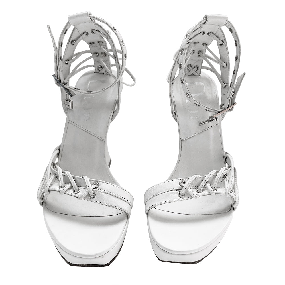 Christian Dior Street Chic rare ankle strap white leather wedge sandals from spring 2003 Dior ad campaign featuring Gisele Bündchen. White leather with small platform and wedge heels and leather soles. Silver grommet details with leather laces woven through Lock and key charms at ankle straps. Made in Italy