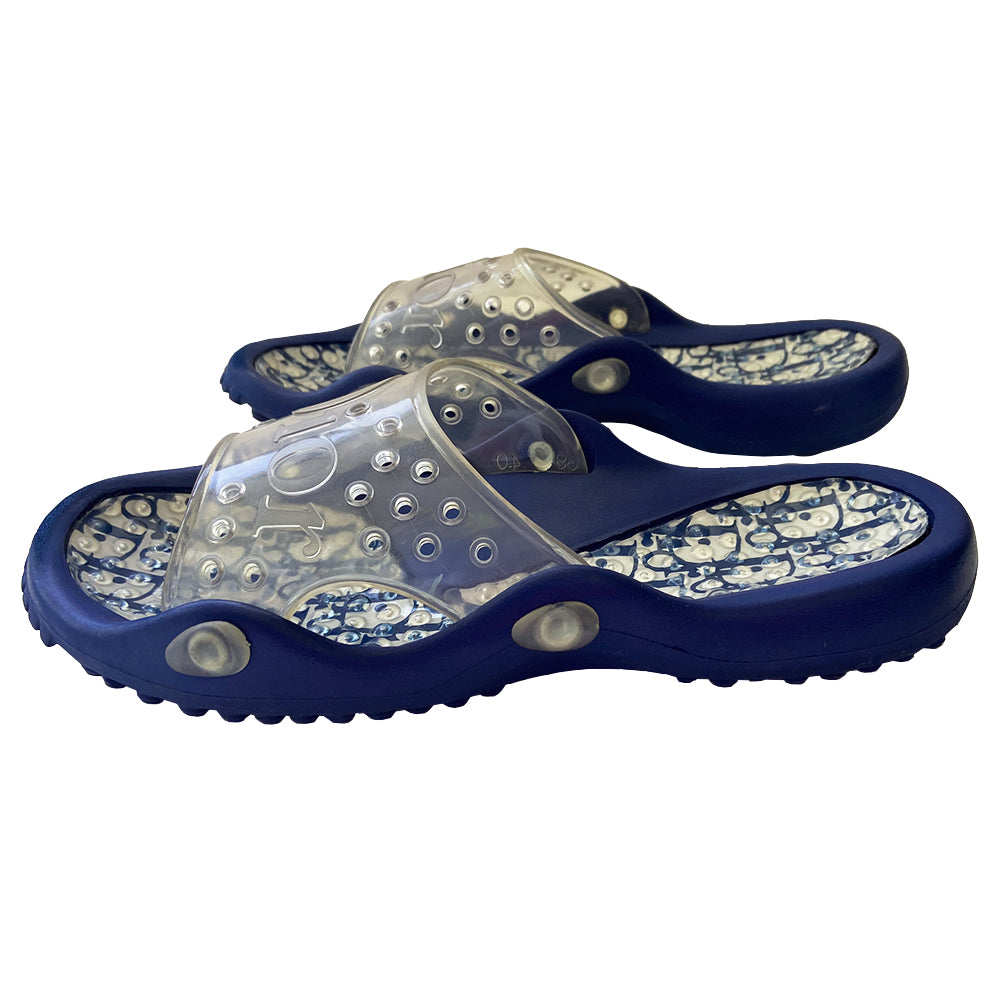 Christian Dior monogram navy on white blue jelly slides sandals from John Galliano early 2000’s era. Dior logo embossed clear upper with perforated air holes. Monogram insole with clear nubby overlay. Rubber bottom sole with Dior logo imprint. Original clear plastic Diorissimo print storage bag included. Made in Italy