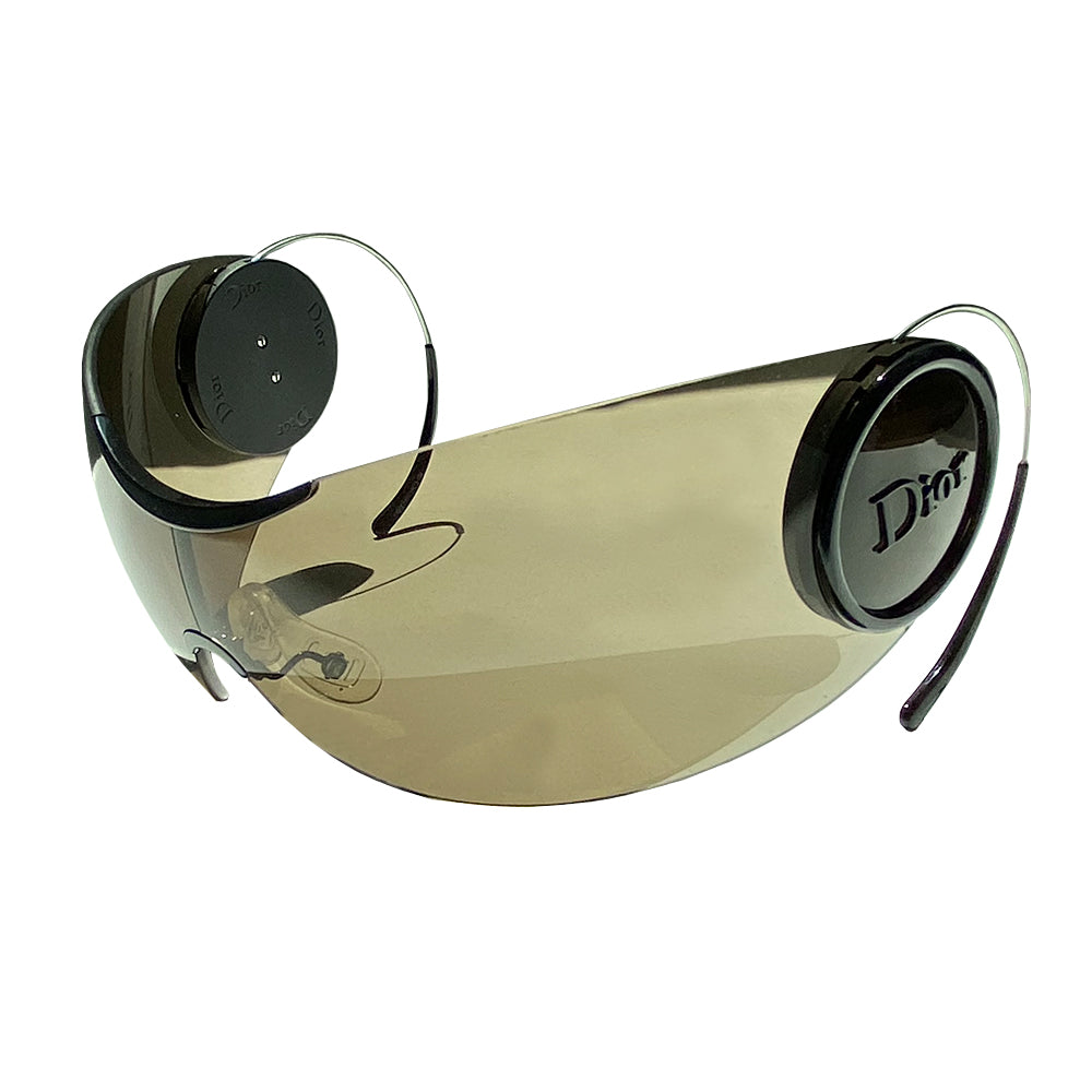 Christian Dior Sport 2 Sunglasses with oversized lens and silver-tone thin wire arms. Round black on black embossed logo at sides of lenses. Faint scratches on lens which doesn’t affect vision. Main Color: Black with dark grey lens. Made in Italy