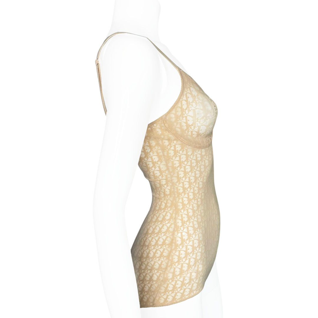 Neutral tone Christian Dior Monogram slip-on stretch bodysuit circa 1990s with low back, adjustable elastic straps, underwire at bust, hooks at crotch. Made in USA