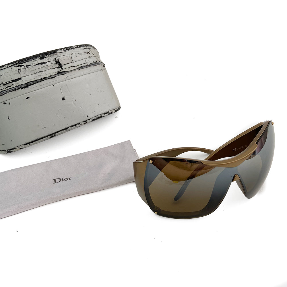 Christian Dior Overshine 1 sunglasses circa early to mid 2000’s. Excellent condition, no scratching on lenses. Oversized solid brown tint lenses, squared rims, gold colored frame with wide arms and Dior name embossed in white on each arm. Style: N6SKB 110 Case and cleaning cloth included. Case shows signs of wear