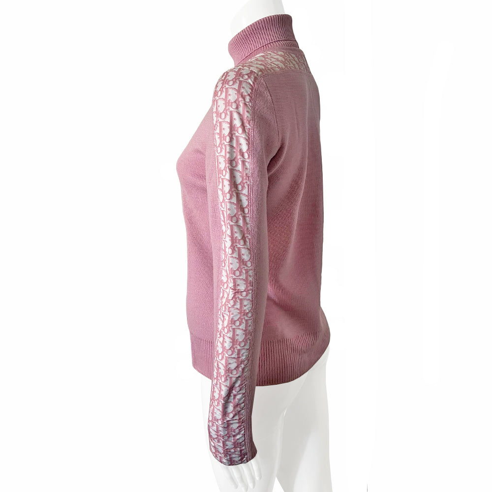 Christian Dior turtleneck pink wool sweater from John Galliano for Christian Dior, winter 2004 with ribbed turtleneck and cuffs, pink Diorissimo accent stripe on sleeves from cuff to neck. Size 38. Made in Italy