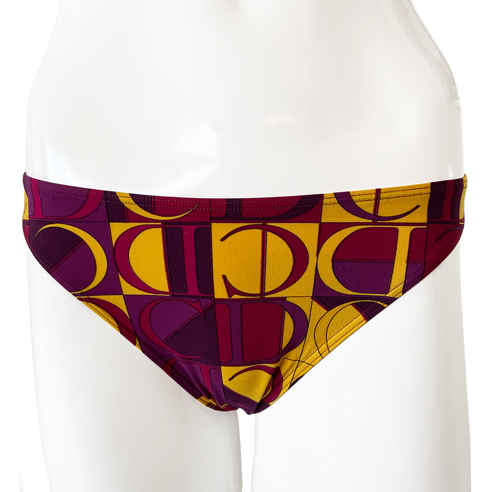 Christian Dior Purple and Yellow CD Logo Bikini with mid rise bottoms and all over modern CD logo print in purple and yellow. Molded bra cups with underwire Gold CD logo clasp closure in back, non-adjustable stretch straps. Made in France
