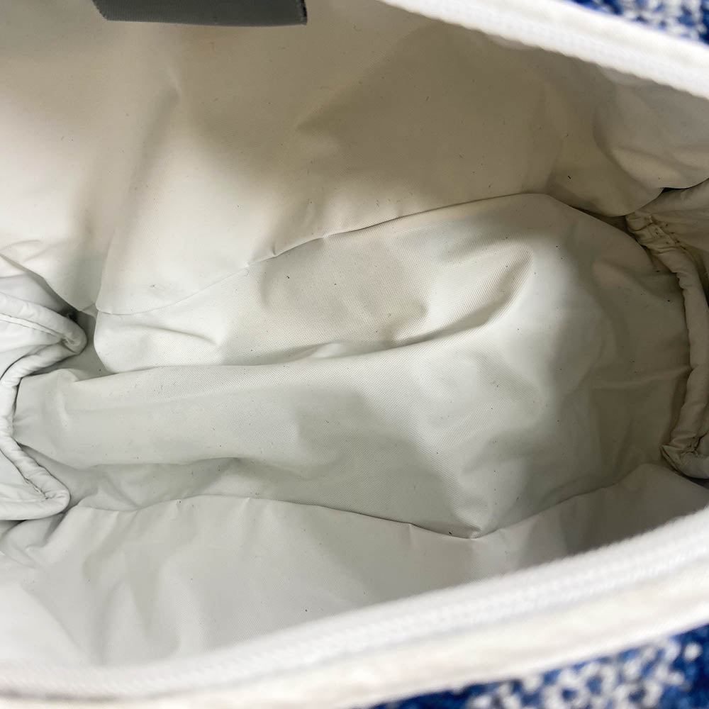 Christian Dior navy monogram terry towel mini boston bag circa 2005 with No. 2 white appliqué in front, white piping on handles and at zipper. Waterproof vinyl interior with 2 slip pockets, zipper closure with white textile ribbon zipper pull.