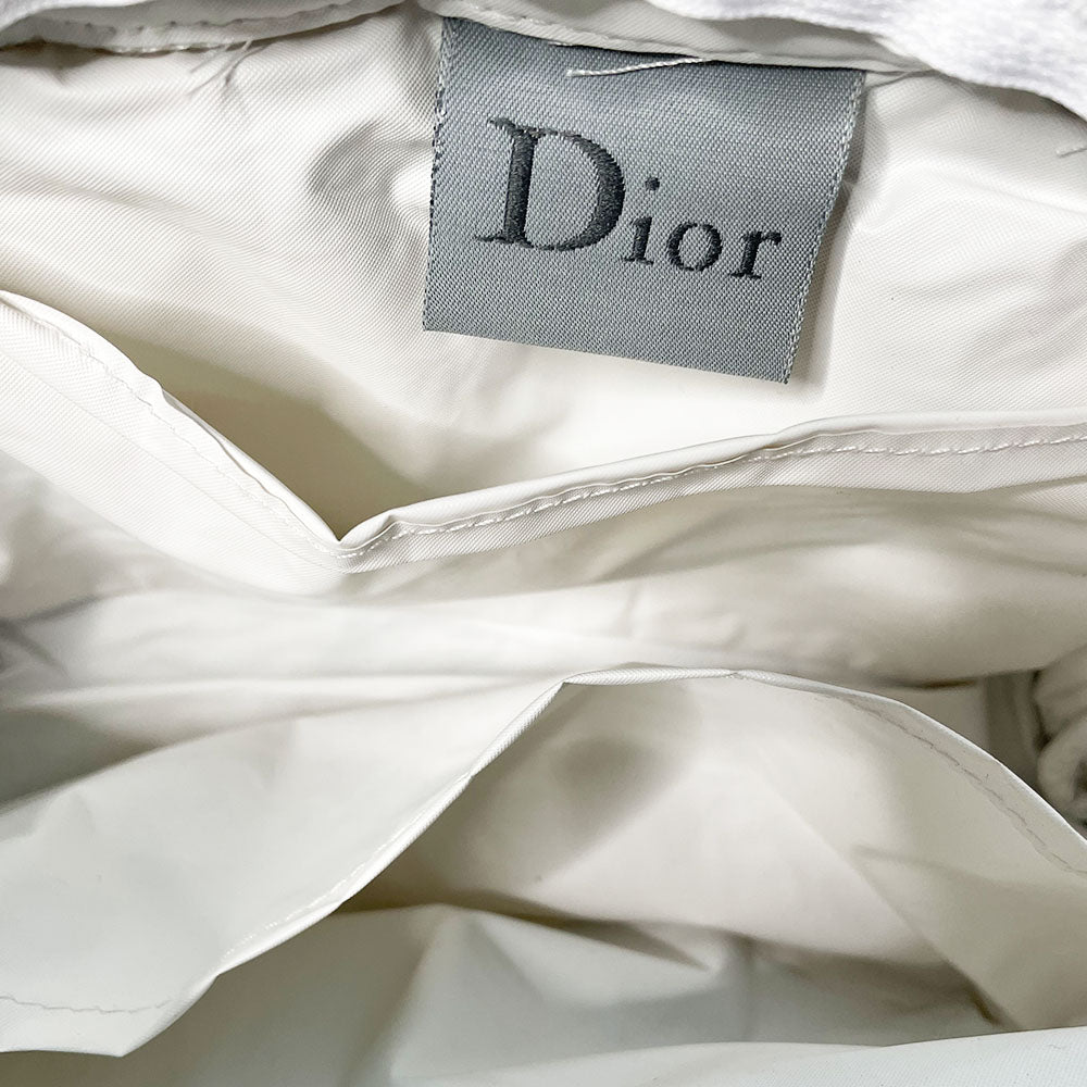 Christian Dior navy monogram terry towel mini boston bag circa 2005 with No. 2 white appliqué in front, white piping on handles and zipper. Waterproof vinyl interior with 2 slip pockets Zipper closure with white textile ribbon zipper pull.