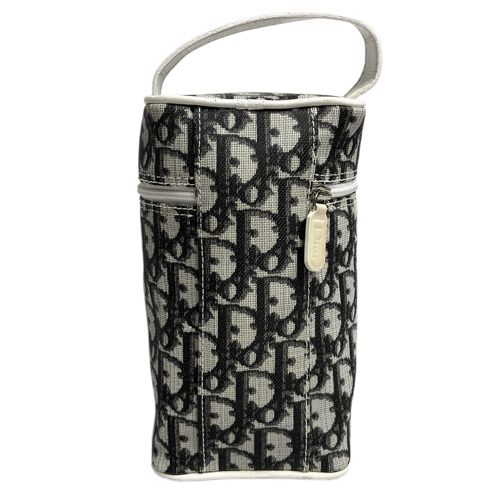 Christian Dior monogram mini vanity case by John Galliano for Dior, 2006. Black and grey monogram canvas rectangular cylinder with white patent piping, No 2 appliqué and top handle. Wrap around silver-tone top zipper closure, black textile interior. Made in Spain