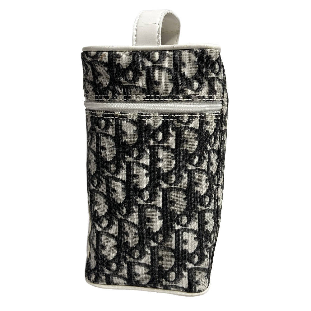 Christian Dior monogram mini vanity case by John Galliano for Dior, 2006. Black and grey monogram canvas rectangular cylinder with white patent piping, No 2 appliqué and top handle. Wrap around silver-tone top zipper closure, black textile interior. Made in Spain