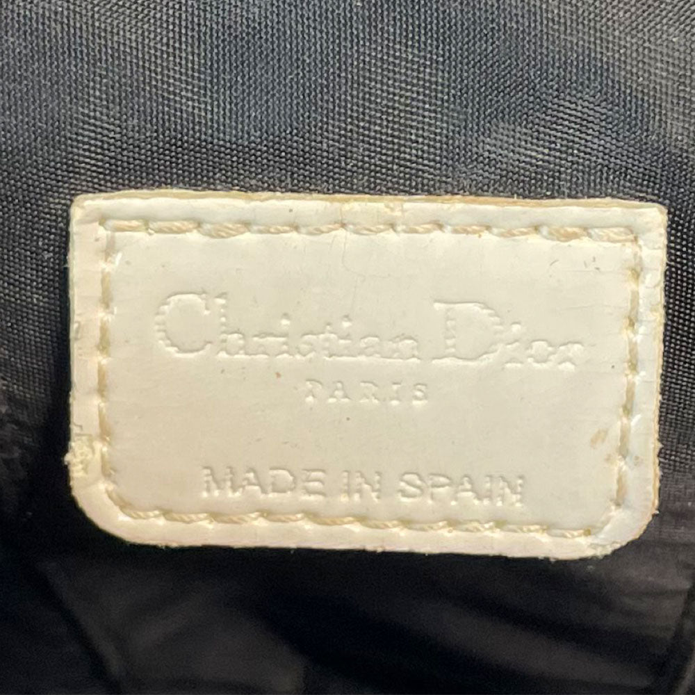 Christian Dior canvas black and grey monogram top handle mini rectangular cylinder bag by John Galliano for Dior, 2003 with white patent piping, top handle and leather No 2 appliqué. Wrap around silver-tone top zipper closure opens to black textile interior. Made in Spain