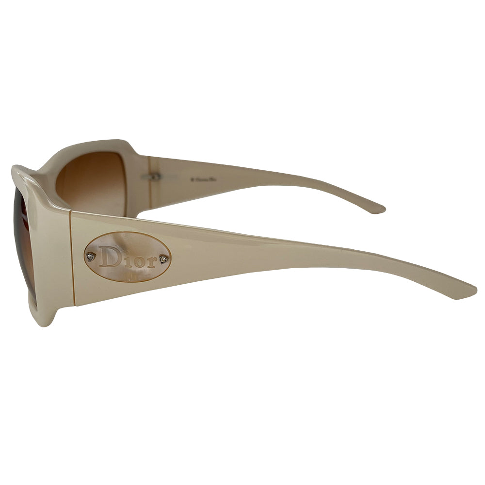 Christian Dior ivory frame sunglasses with amber gradient lenses and wide arms Dior embossed oval mother of pearl Dior name plate attached with embedded crystals at each arm. Style: Classicdior 1/F CQLBA Condition: Excellent, no scratches on lenses or frame Made in Italy