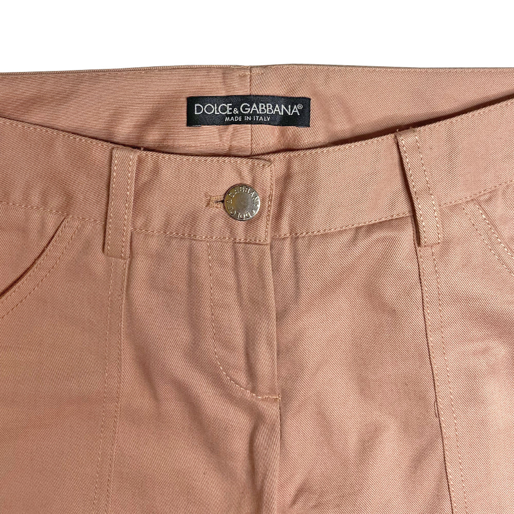 D&G pink Sex Bondage Strap Pants, SS 2003 SEX runway with 2 oversized front patch pockets, silver-tone hanging D rings. Side panels feature 4 black leather straps, logo engraved buckles, single adjustable fabric strap that wraps at knee. Cargo flap pocket in back with engraved silver-tone logo button, appliqué SEX logo patch. Made in Italy