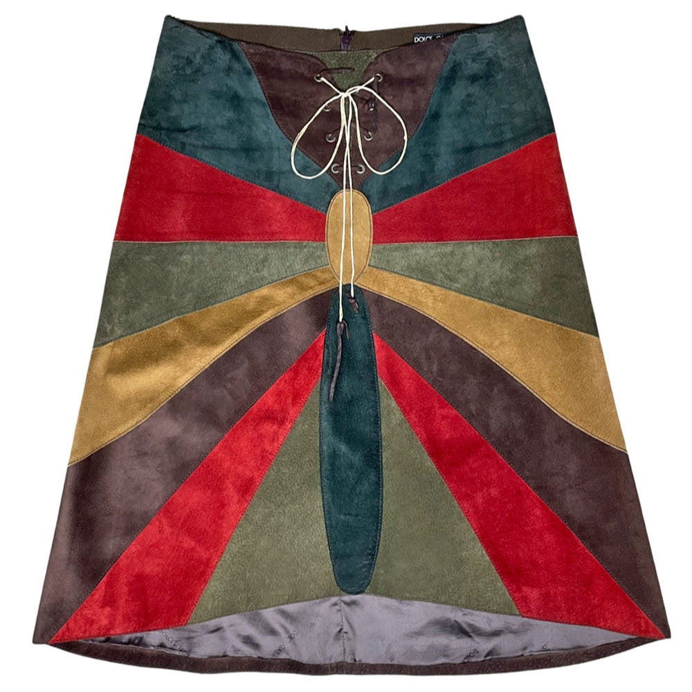 FW 2002 patchwork A-line red, turquoise, olive and tan suede skirt with slight rise in front hemline, lacing at front waist, silk jacquard logo lining, invisible back zipper. Made in Italy