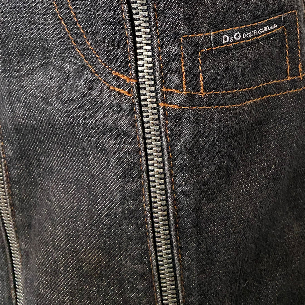 Dolce & Gabbana Zip Panel Black Denim Mini Skirt from 2004 with 10 zippered denim panels and silver-tone D&G stamped zipper pulls that unzip individually from bottom to top. Accent stitching to mimic jeans pockets in back and front. D&G tag attached to faux front pocket. Made in italy