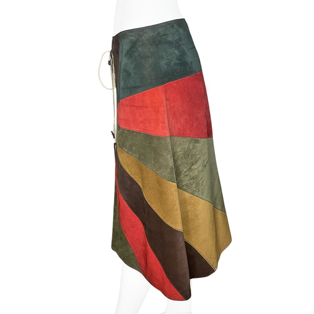 FW 2002 patchwork A-line red, turquoise, olive and tan suede skirt with slight rise in front hemline, lacing at front waist, silk jacquard logo lining, invisible back zipper. Made in Italy