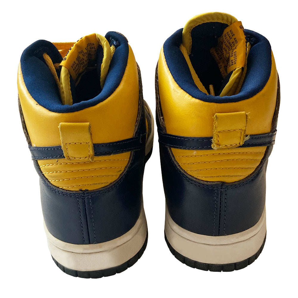 Nike Dunk High LE Michigan 1998 reissue from from the original 1985 debut "Be True to Your School" collection University of Michigan colors Varsity Maize / Navy. Material: Leather upper, nylon tongue Size: Men’s US 7 /EU 40