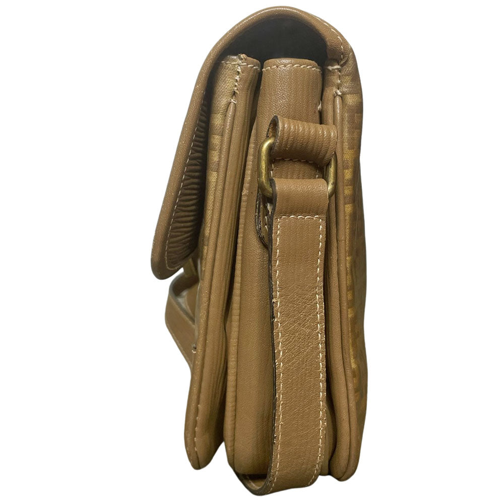 Fendi SAS circa 1970's tan and brown patent leather monogram FF Zucca print cross-body bag with front closure strap that wraps around bag and through brushed gold tone hardware. Long leather strap suitable to wear cross body, brown leather lining with three open interior sections and one zip pocket. Made in Italy