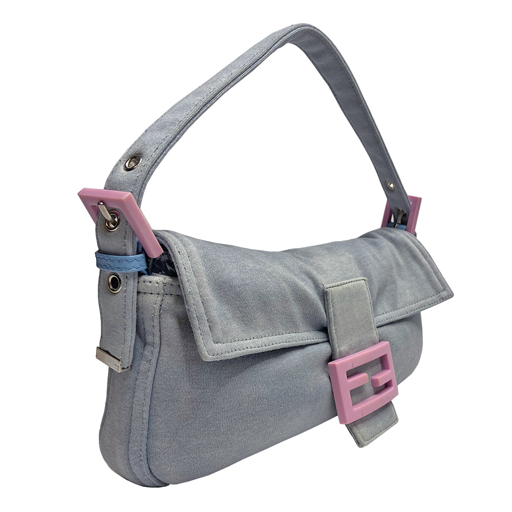 Fendi Jersey Fabric Baguette powder blue jersey fabric baguette with adjustable removal strap, pink rubber buckles and front logo with silver-tone metal hardware. Front flap with magnetic closure, jersey lined with interior zippered pocket. Made in Italy