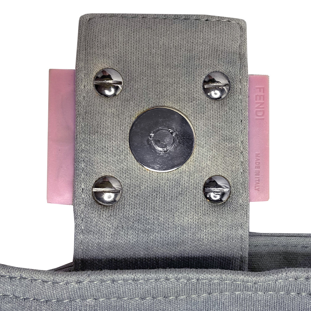 Fendi Jersey Fabric Baguette powder blue jersey fabric baguette with adjustable removal strap, pink rubber buckles and front logo with silver-tone metal hardware. Front flap with magnetic closure, jersey lined with interior zippered pocket. Made in Italy