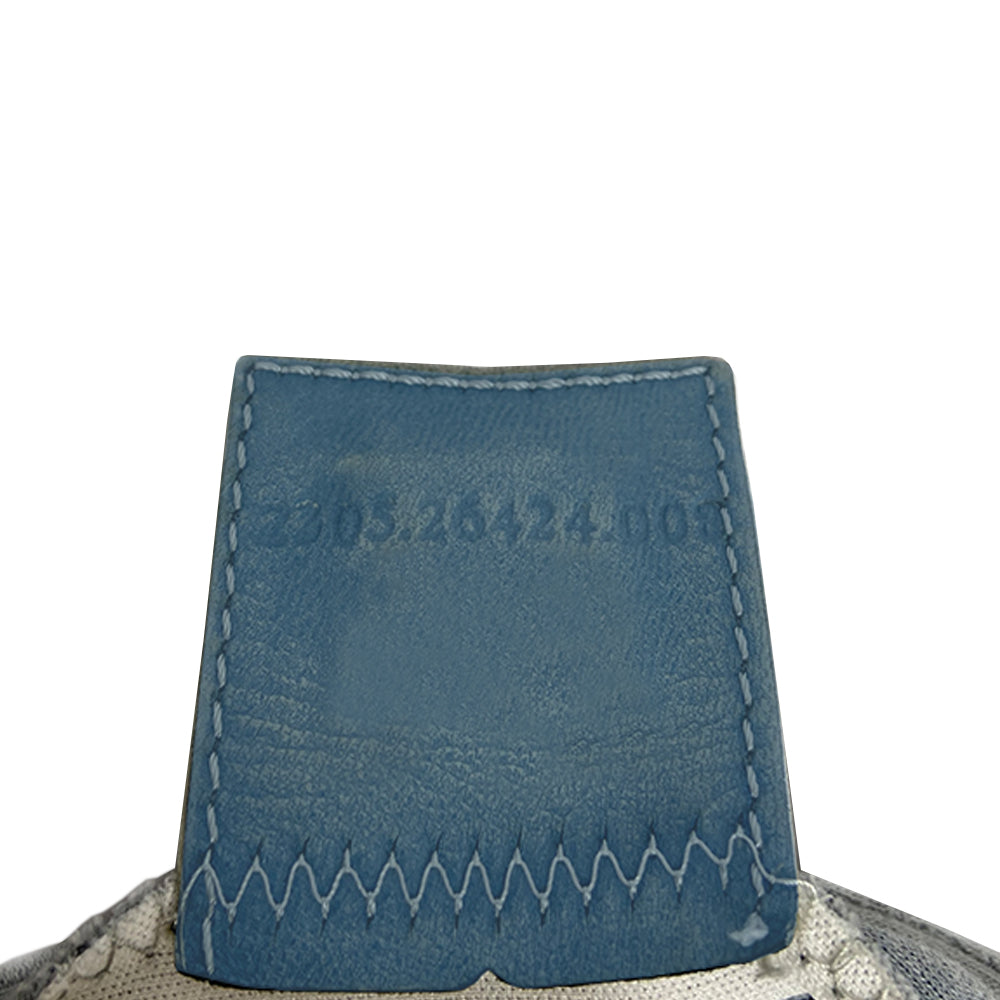 Fendi Jersey Fabric Baguette powder blue jersey fabric baguette with adjustable removal strap, pink rubber buckles and front logo with silver-tone metal hardware. Front flap with magnetic closure, jersey lined with interior zippered pocket. Made in Italy
