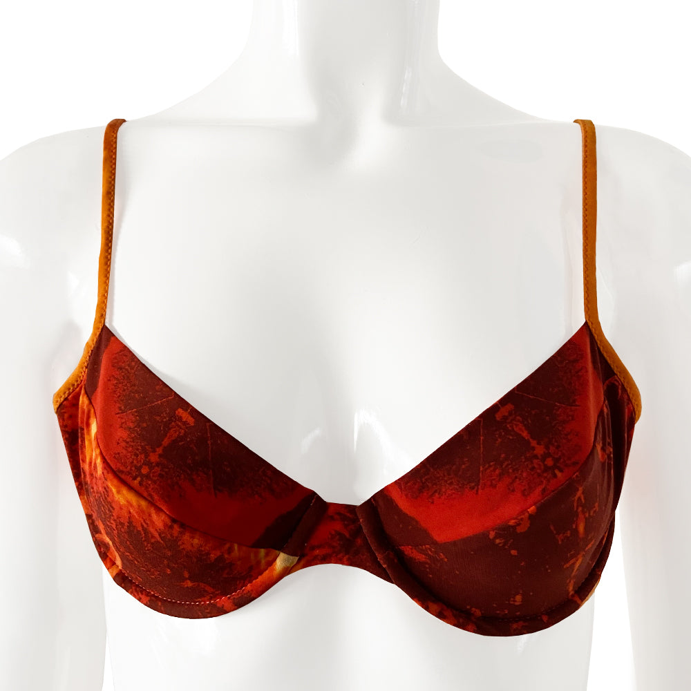 New Jean Paul Gaultier orange/black/gold color Hawaiian graphic print bikini from the Soleil collection. Top and mid-rise bottoms feature Hawaiian girl against tropical background. Soft unstructured bra with underwire cups, back clasp closure, contrast stretch straps. Partially lined Size: IT 42 Made in Italy