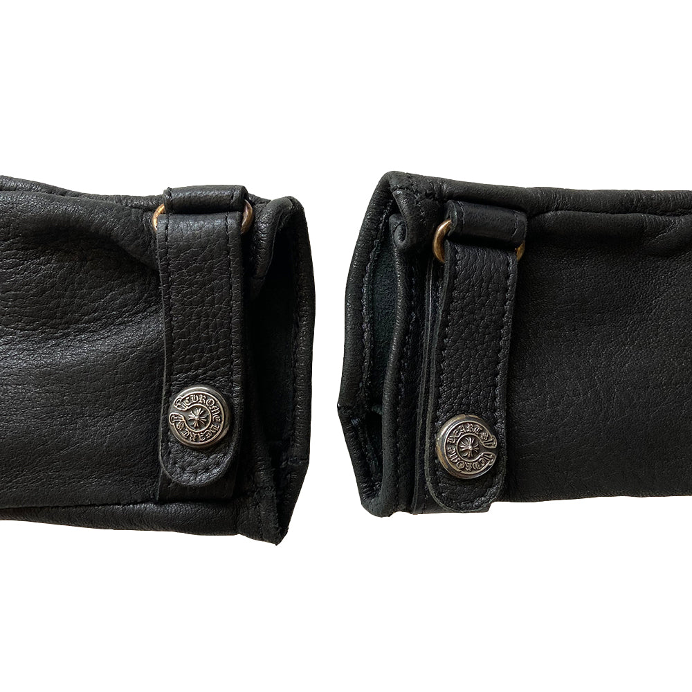 Chrome Hearts black size 7.5 leather gloves, circa mid 2000’s. Unlined with leather wrist strap and sterling silver logo snap button closure. Made in USA