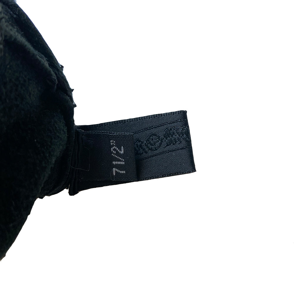 Chrome Hearts black size 7.5 leather gloves, circa mid 2000’s. Unlined with leather wrist strap and sterling silver logo snap button closure. Made in USA