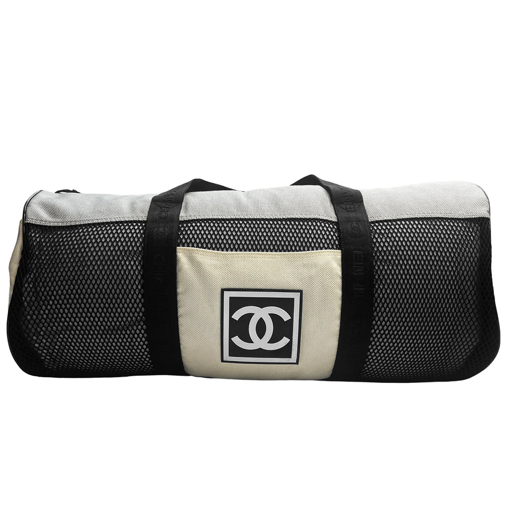 Chanel sport canvas and mesh large grey/black/cream duffle bag by Karl Lagerfeld for Chanel, 2003/2004 zipper closure and boxed rubber CC front logo, 2 exterior end pockets and one exterior front pocket. Double Chanel embossed satin webbing logo carry straps. Serial number sticker attached. Made in Italy