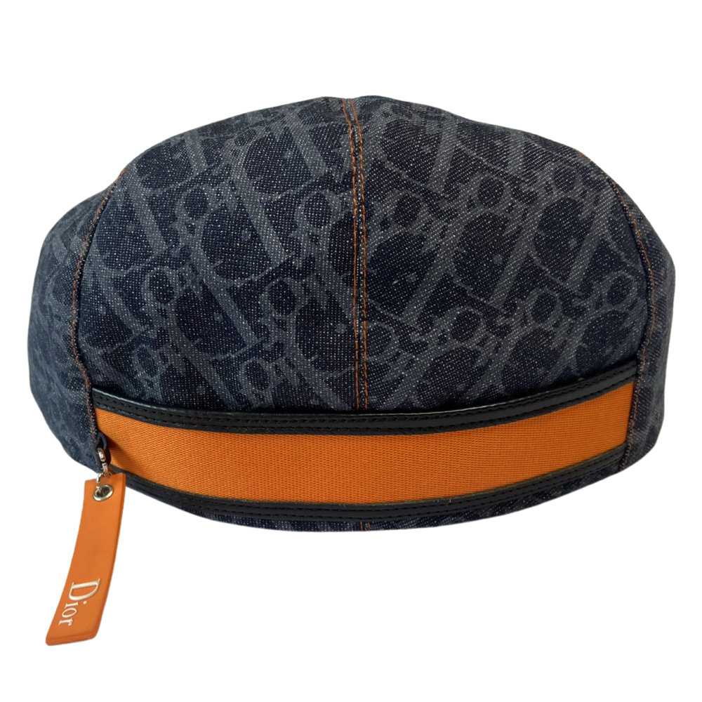 Christian Dior navy monogram flat cap by John Galliano for Dior, 2004 with orange contrast stitching, orange band, calf leather accent trim and orange rubber Dior logo hanging tag attached. Grosgrain interior ribbon and navy textile lining. Made in France