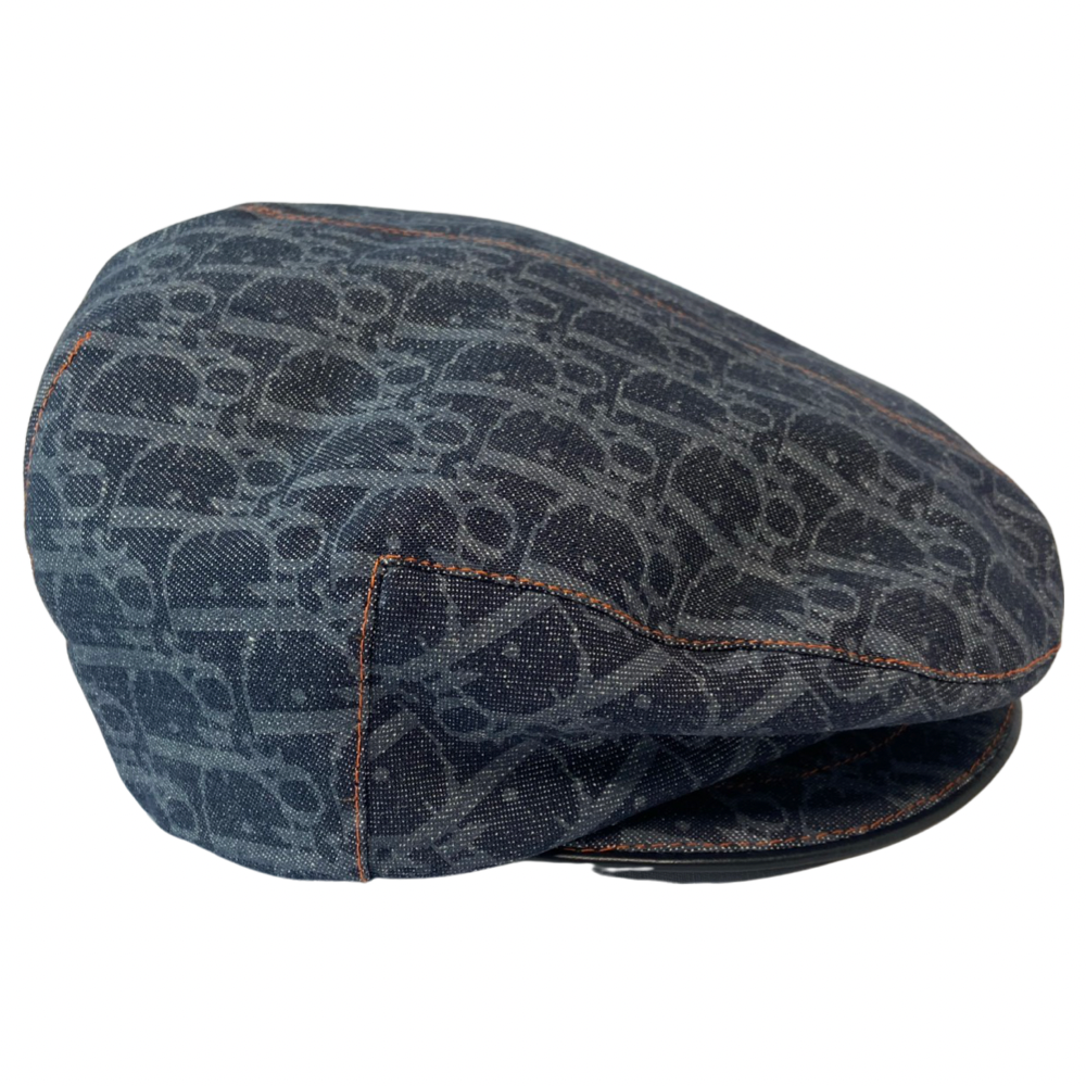 Christian Dior navy monogram flat cap by John Galliano for Dior, 2004 with orange contrast stitching, orange band, calf leather accent trim and orange rubber Dior logo hanging tag attached. Grosgrain interior ribbon and navy textile lining. Made in France