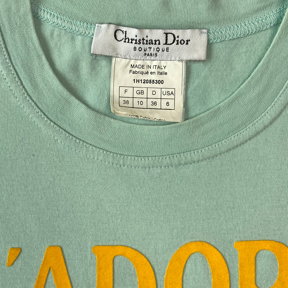 Christian Dior J’Adore Dior 1947 World Champion light blue with yellow letters sleeveless tee John Galliano for Christian Dior, FW 2001 with velvety appliqué lettering front and back. J’Adore Dior in front with World Champion 1947 in back. Made in Italy