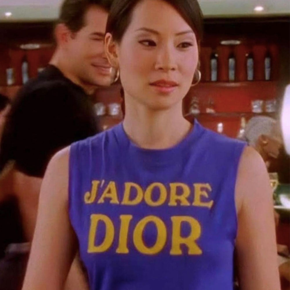 John Galliano for Christian Dior, Winter 2001 sleeveless royal blue crew neck tank with yellow J’Adore Dior printed in fron land World Champion 1947 on back. Made in Italy