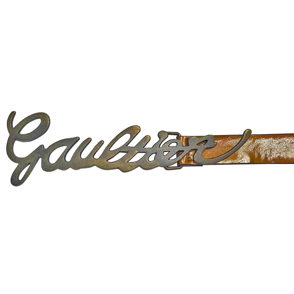 Jean Paul Gaultier deep caramel-tone patent leather belt with cursive Gaultier signature lock-tonged antique brass-tone metal buckle. Adjustable sizing with 5 hole adjustment, Jean Paul Gaultier interior stamp.