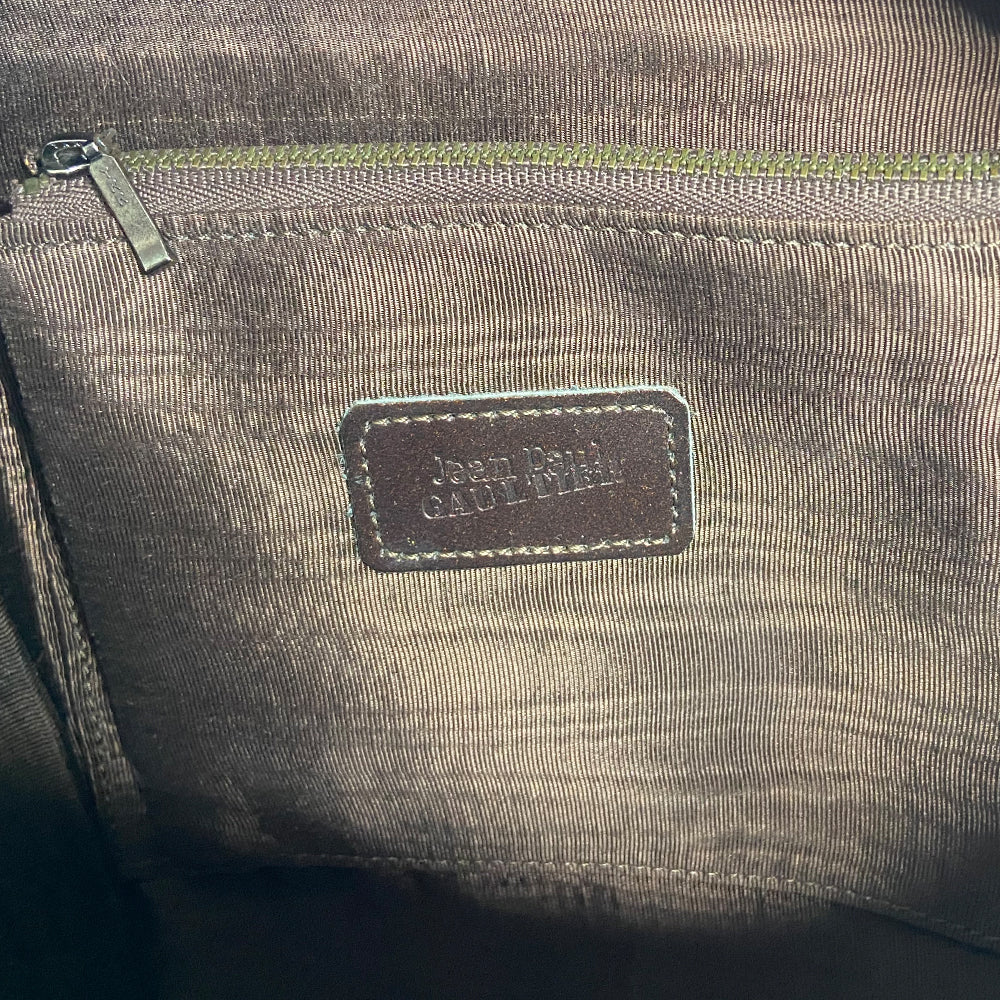 Jean Paul Gaultier 1998 leather backpack in the shape of the Gaultier iconic corset embellished with hologram vinyl front inserts, antique brass hardware. Adjustable length leather straps, Jean Paul Gaultier embossed in back, top dual Gaultier engraved zippers, textile lining, interior zip pocket.