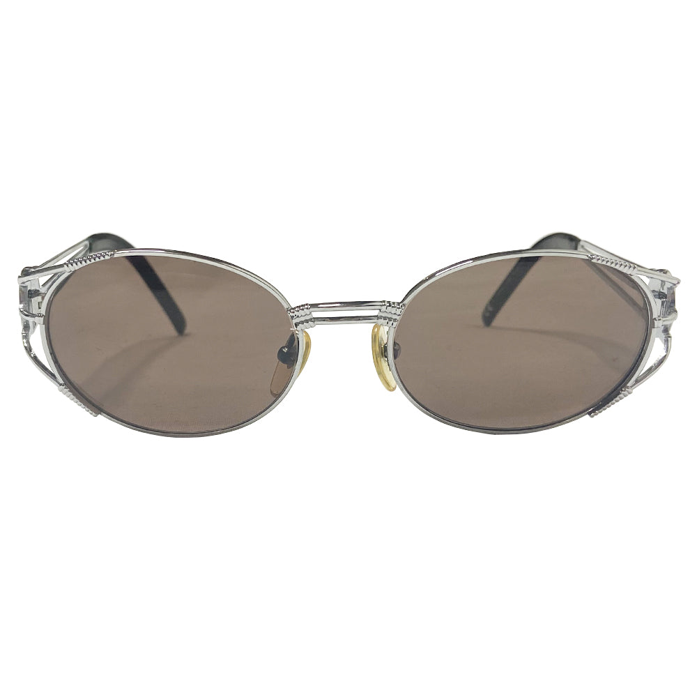 JPG oval lens 1990’s silver-tone metal frame sunglasses with brown lenses by Jean Paul Gaultier JPG with triple bar arms attached to plastic end piece and JPG logo at temples. 100% UV protection. Style: 58-5102 Made in Japan