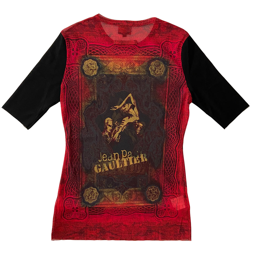 Jean Paul Gaultier tattoo artist 3/4 sleeve mesh top Jean Paul Gaultier Femme circa 1995 featuring Jean Paul Gaultier tattooing a woman’s arm on front and back. Tag size: 40 Main Colors: Red, black sleeves. Made in Japan