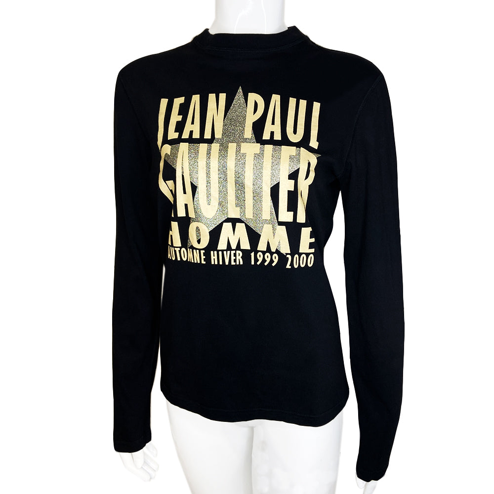 Jean Paul Gaultier long sleeve black logo tee from Jean Paul Gaultier Classique, FW 1999/2000 with Jean Paul Gaultier Automne Hiver 1999 2000 printed over silver-tone star. Tag size: 48 Made in Japan