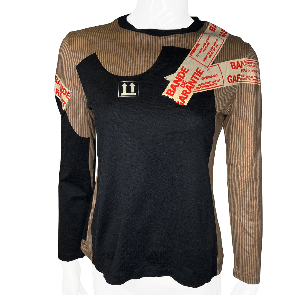 Jean Paul Gaultier, JPG label circa 90’s early 2000’s long sleeve beige pinstripe top with trompe l’oeil black tee shirt overlay and packing tape print in front and back. Tag size: 40 Main Colors: Brown, black. Made in Japan