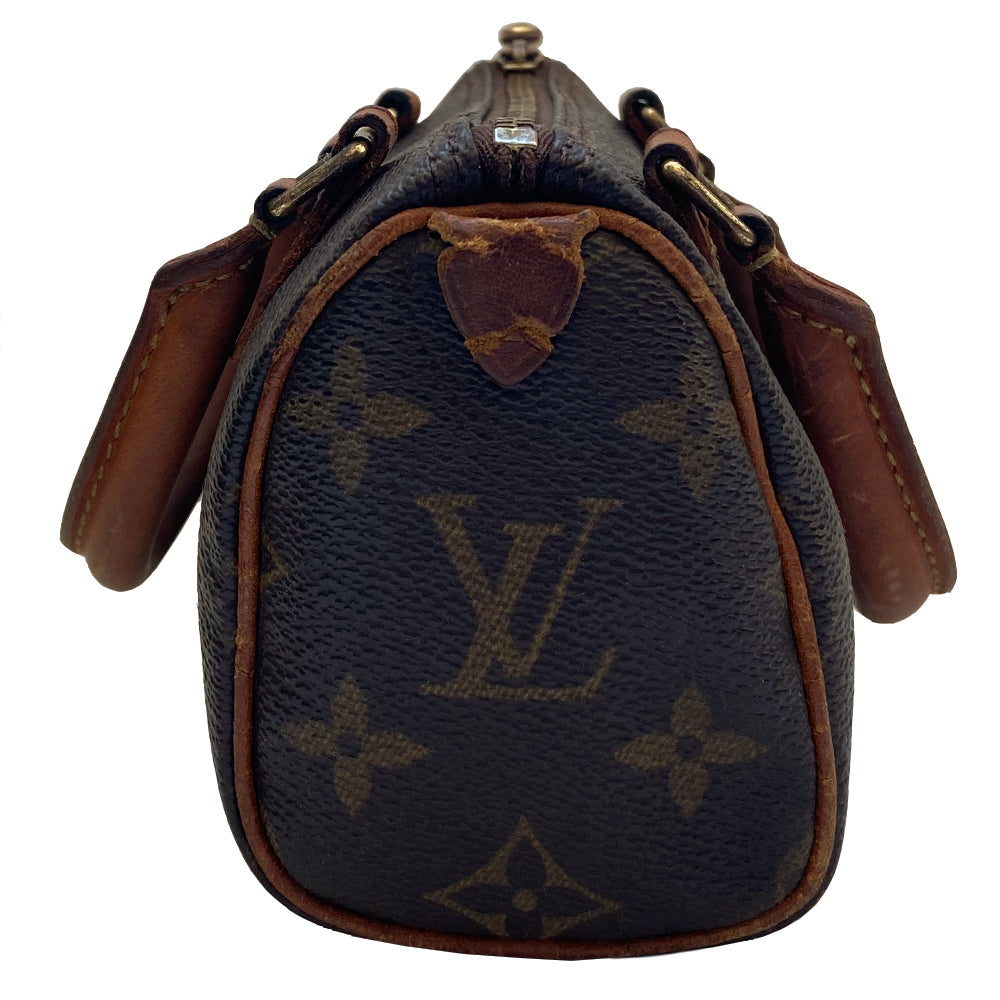 Louis Vuitton Monogram Nano Speedy bag from 1994 with vachetta leather rolled handles, piping and accent and gold-tone hardware. Top zip closure, canvas lining, interior date code is visible. Made in France