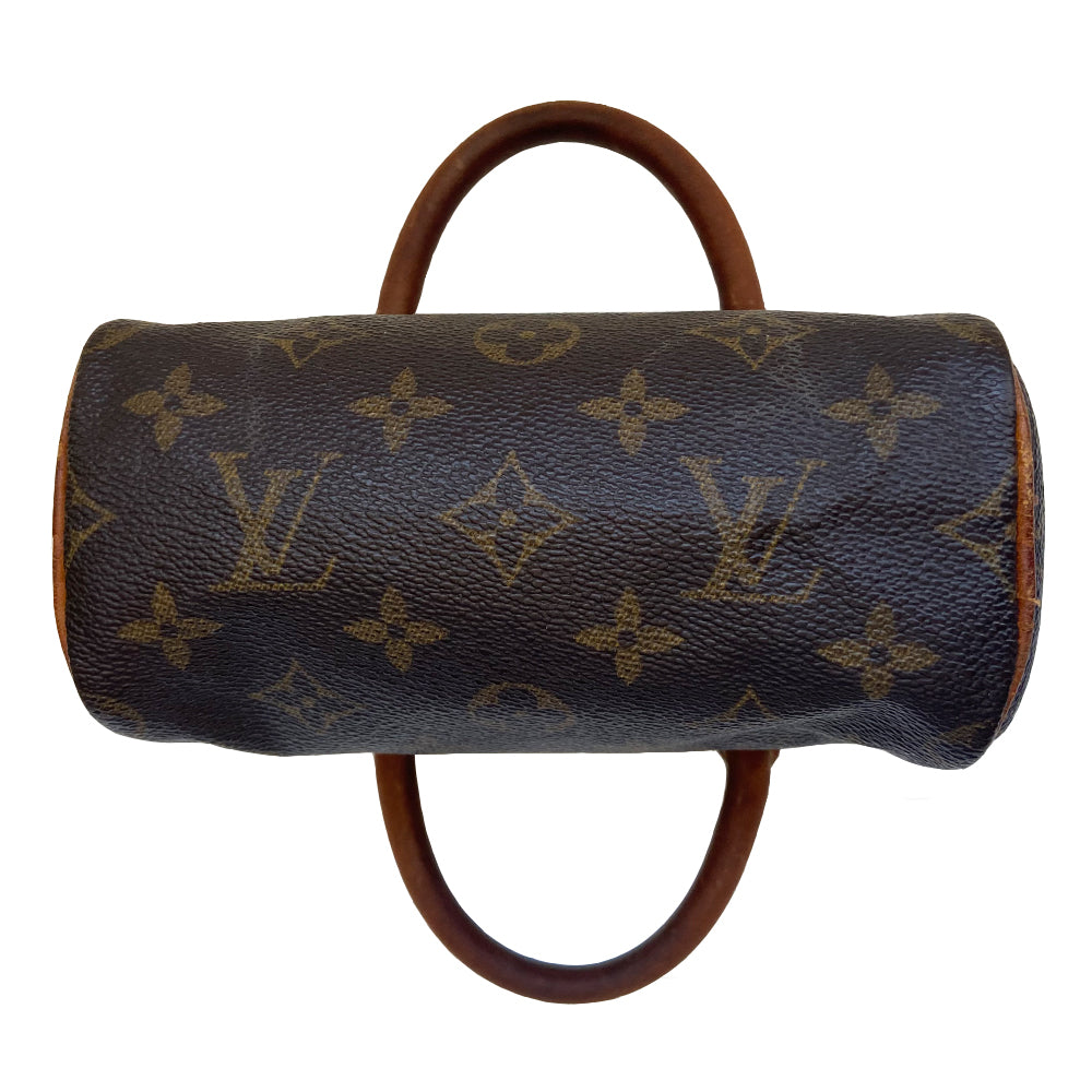 Louis Vuitton Monogram Nano Speedy bag from 1994 with vachetta leather rolled handles, piping and accent and gold-tone hardware. Top zip closure, canvas lining, interior date code is visible. Made in France