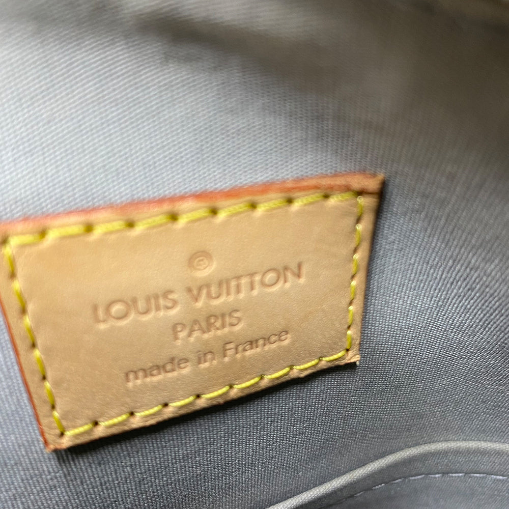 Louis Vuitton mirrored silver-tone monogram embossed vinyl Alma GM bag by Marc Jacobs for Louis Vuitton, 2008 with mirrored silver-tone leather dual handles, trim, bottom with tonal metal feet. Silver-tone top zipper with dual mirrored leather zipper pulls, grey textile interior with open slip and cell phone pocket. Made in France